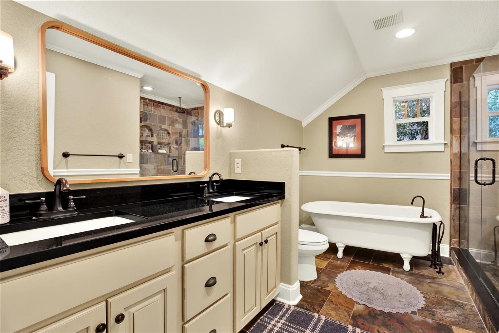 Keeping with the craftsman aestheic, the upper primary bathroom exudes charm with modern day conveniences