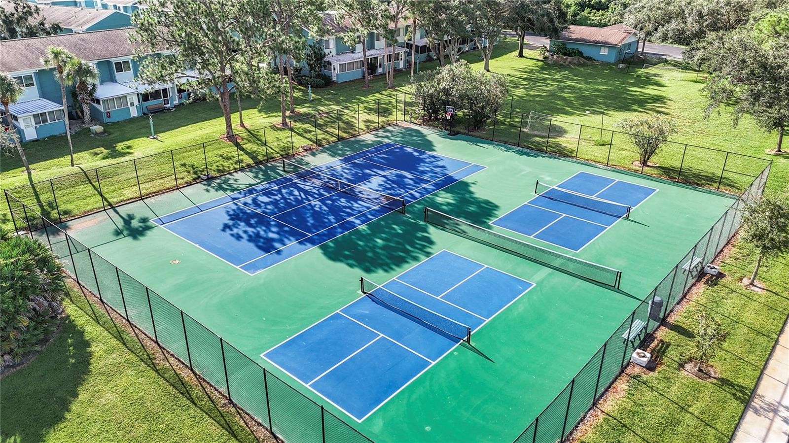 Tennis and pickleball courts with Park