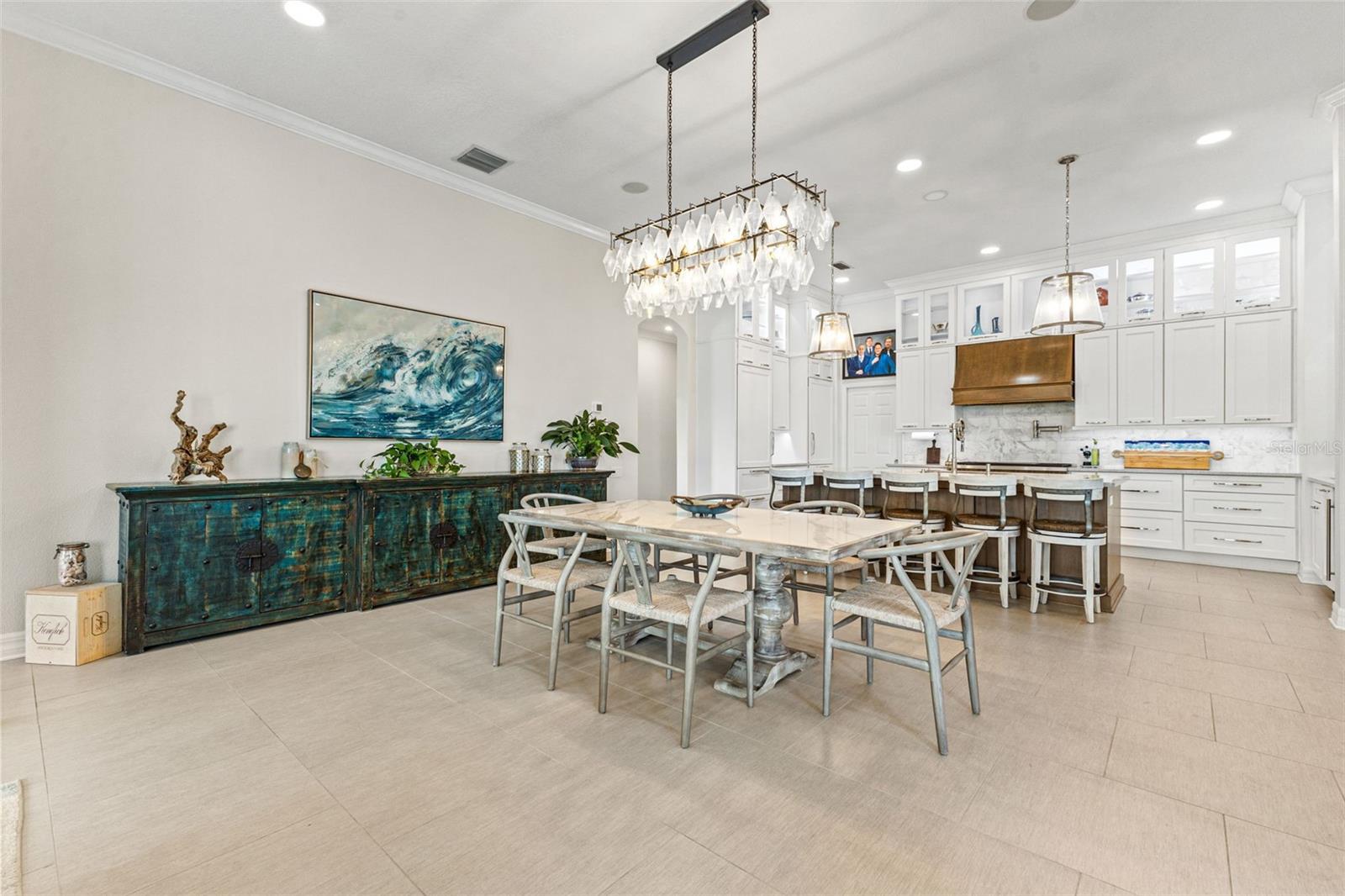 Dining area with view into kitchen and family room