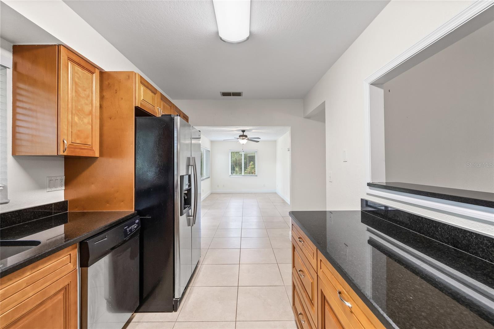 2 separate living spaces both lead to the kitchen