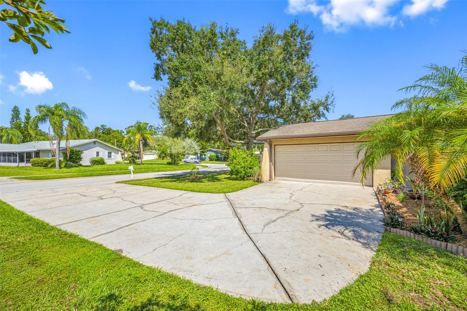 Large driveway with side entry garage.