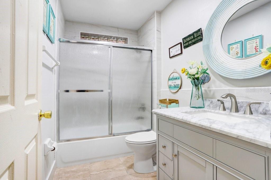 Guest bathroom with new vanity and renovated shower