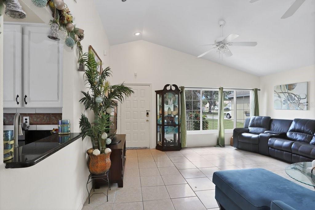 View to the front door. Living Room/Dining Room combo with kitchen to the left