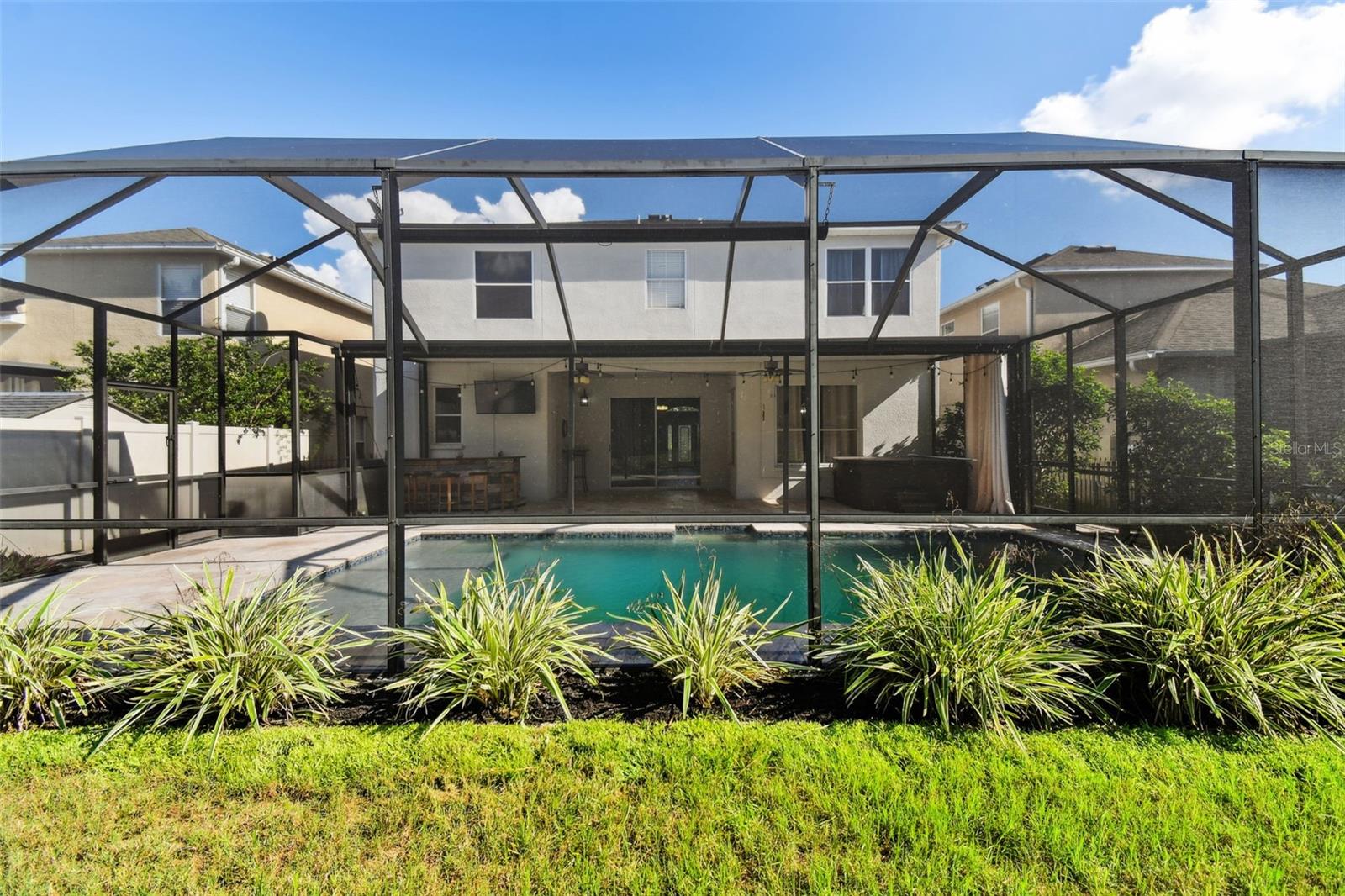 view from backyard to pool