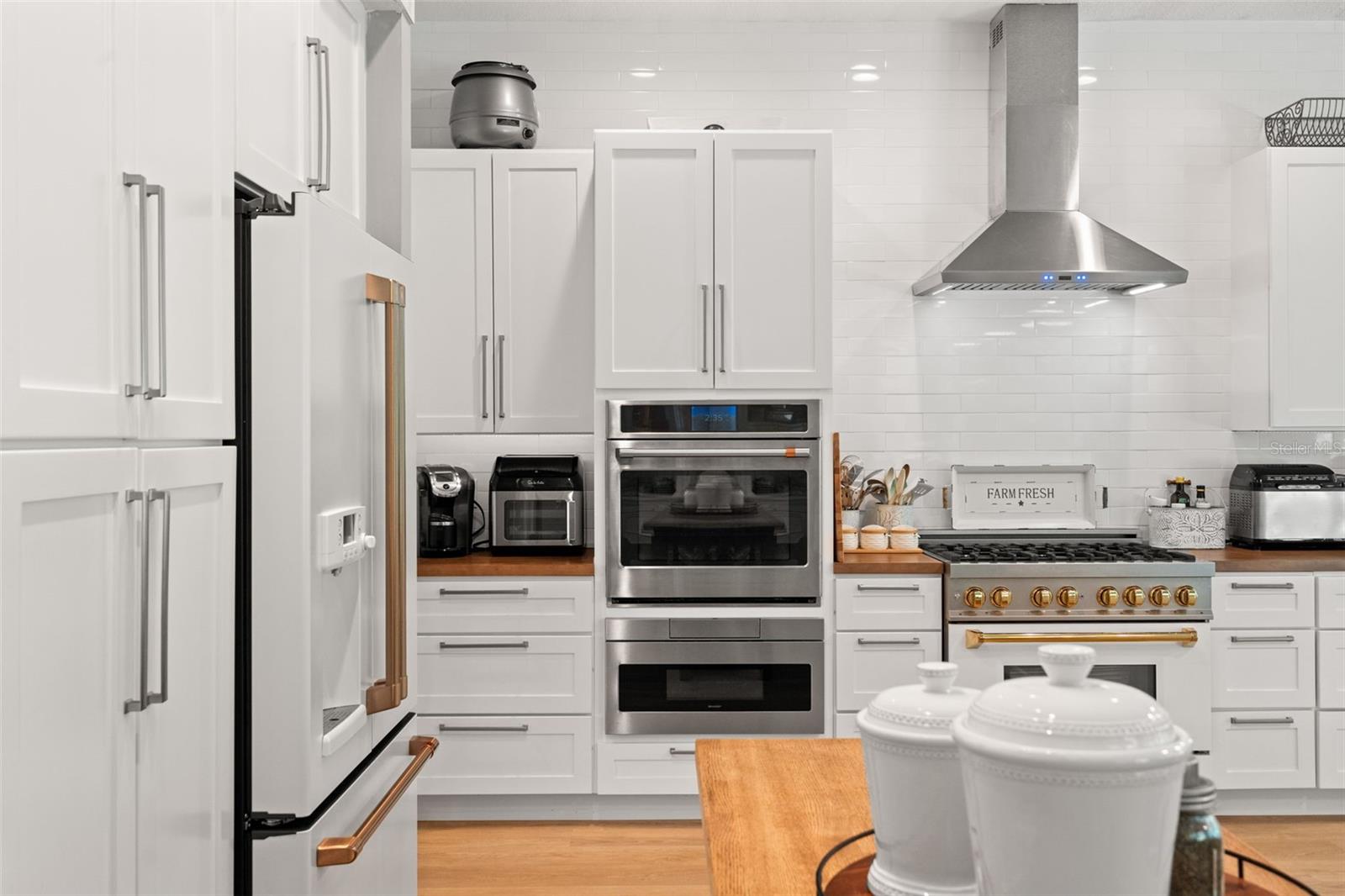 Baker's kitchen with two 36" ovens and a drawer microwave.