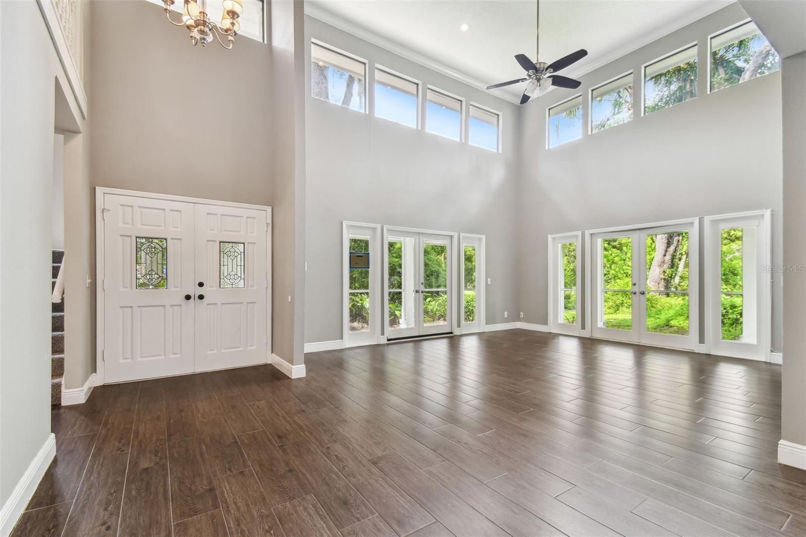 Entrance/Living Room w/soaring ceilings & lots of windows