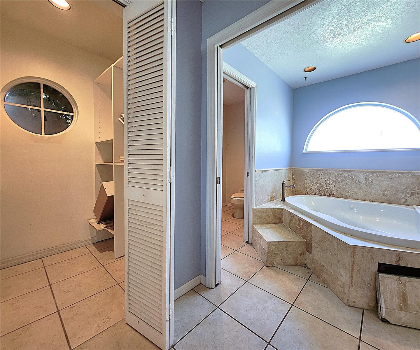 Jack-n-Jill Master Bathroom includes His & Hers Walk-in closets, private water closet, tiled walk-in shower, garden tub with jets, dual sink vanity