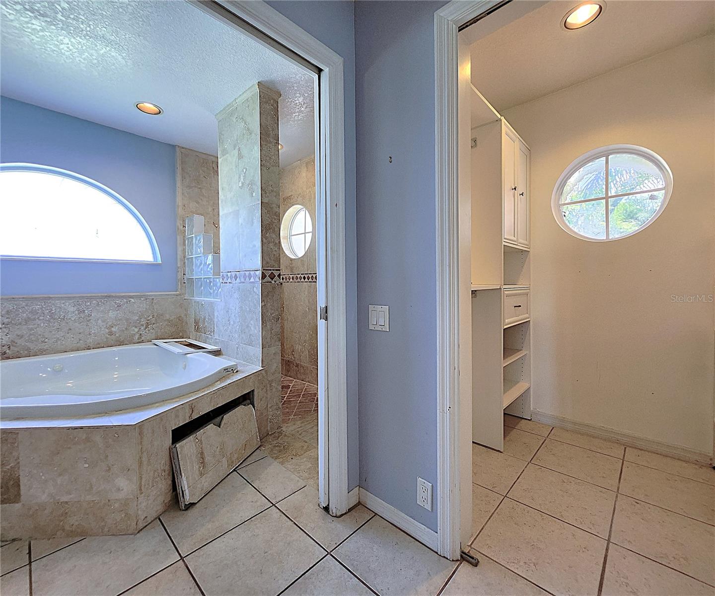 Jack-n-Jill Master Bathroom includes His & Hers Walk-in closets, private water closet, tiled walk-in shower, garden tub with jets, dual sink vanity