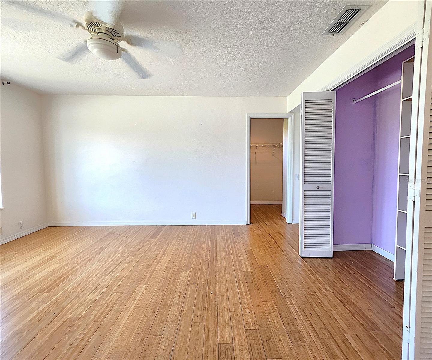 Third Bedroom on the upper level includes two closets: built in and walk-in