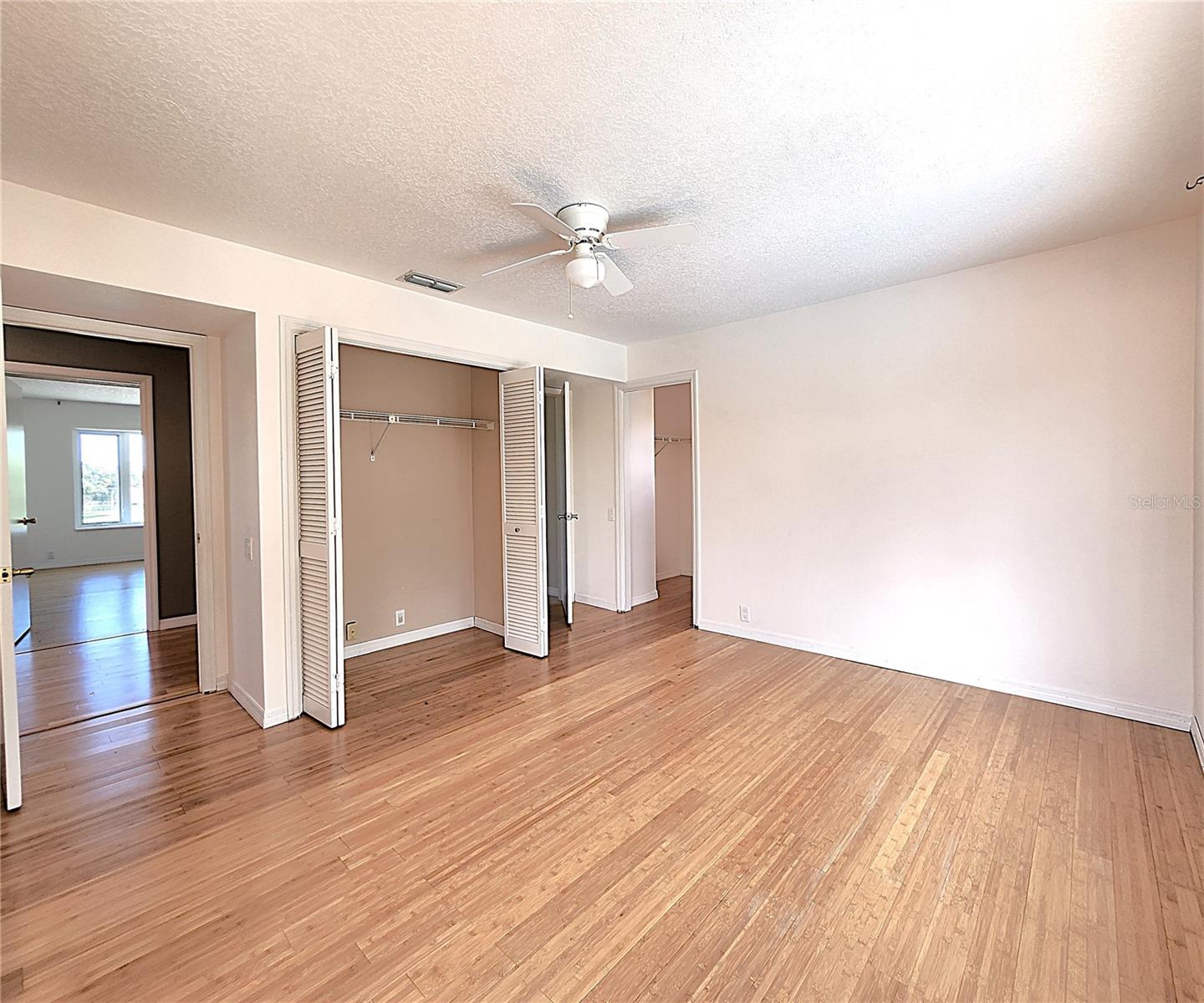 Fourth Bedroom on the upper level includes two closets: built in and walk-in