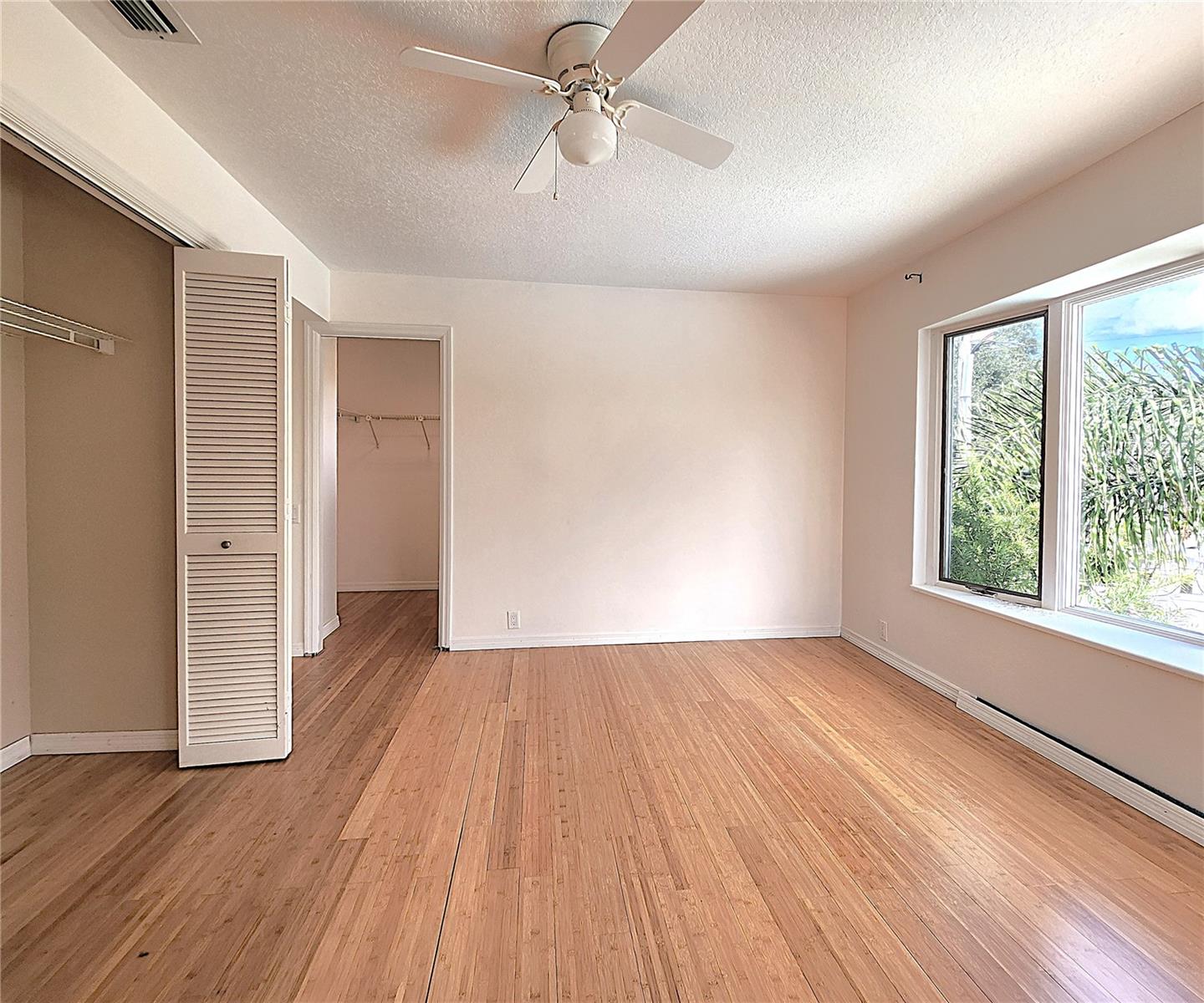 Fourth Bedroom on the upper level includes two closets: built in and walk-in