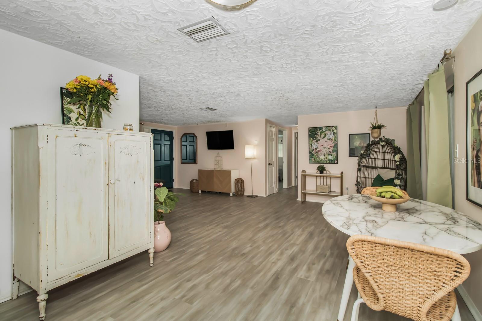 View from Kitchen into Dining Area and Living Room