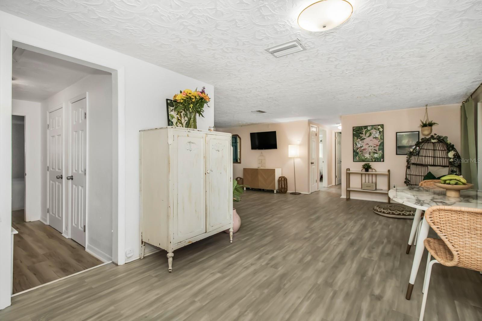 View from Kitchen into Dining Area and Living Room