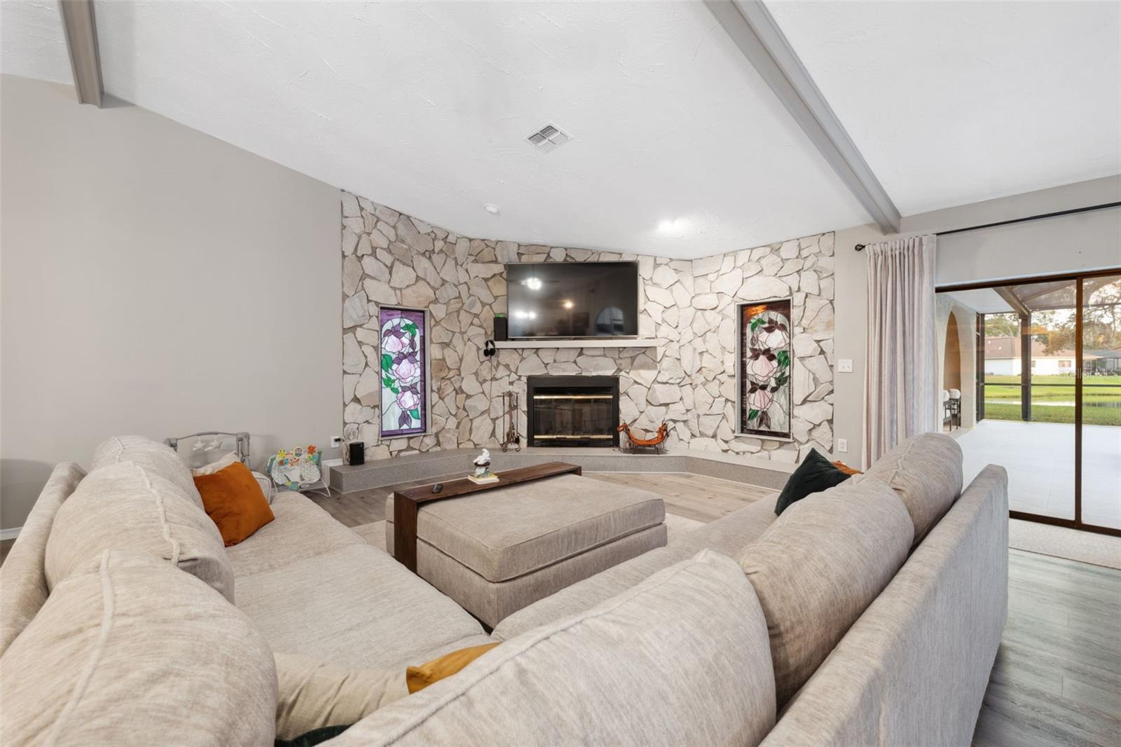 Living Room, stained glass flanks the fireplace