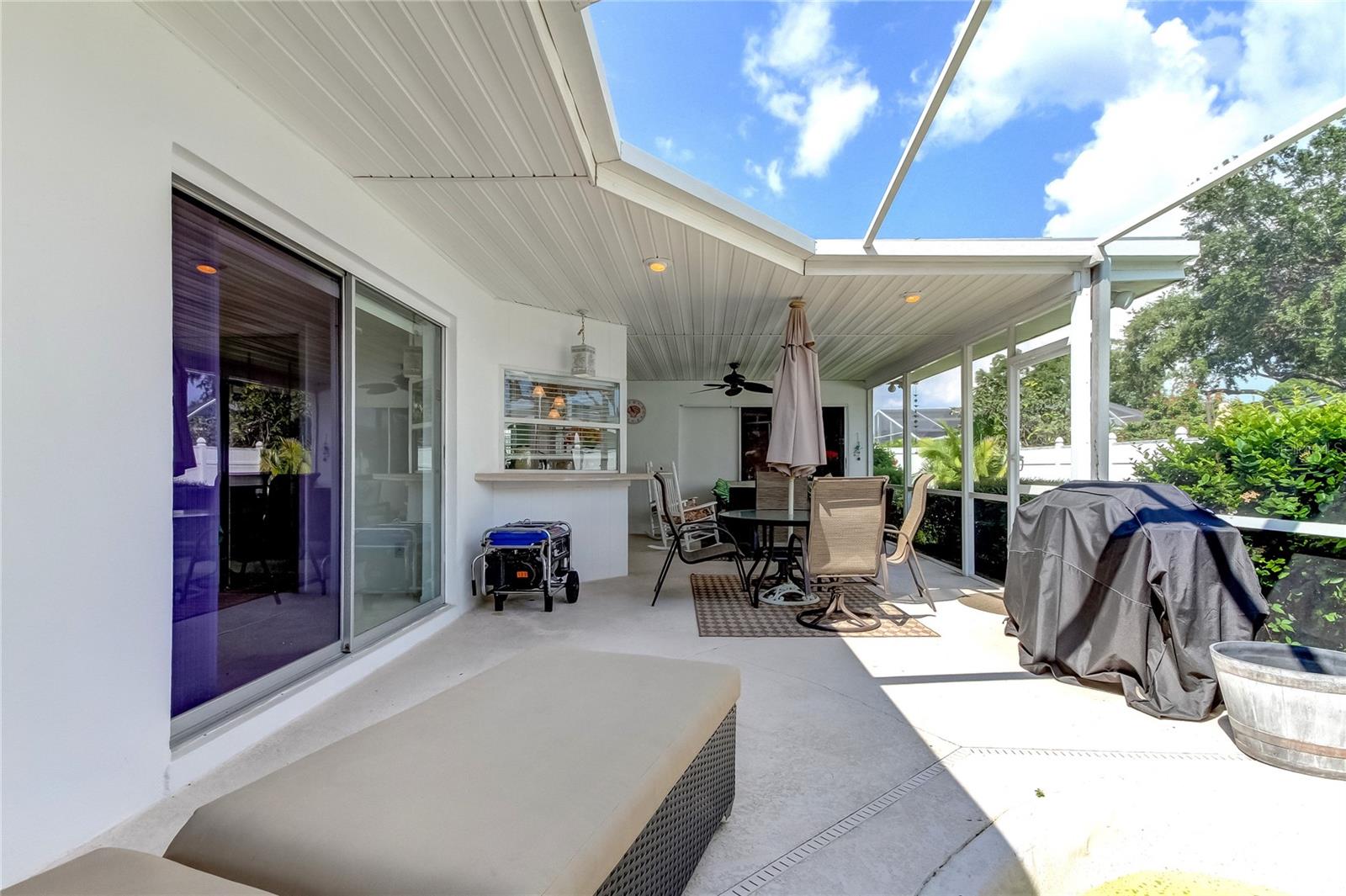 Patio with sliders to Primary Bedroom