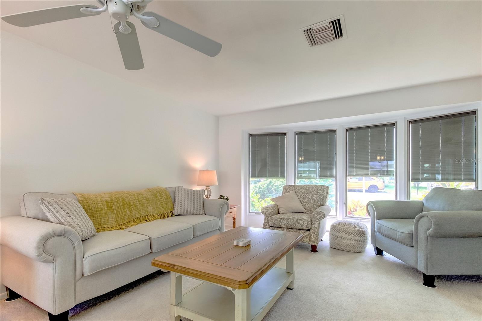 Formal living room with bay windows