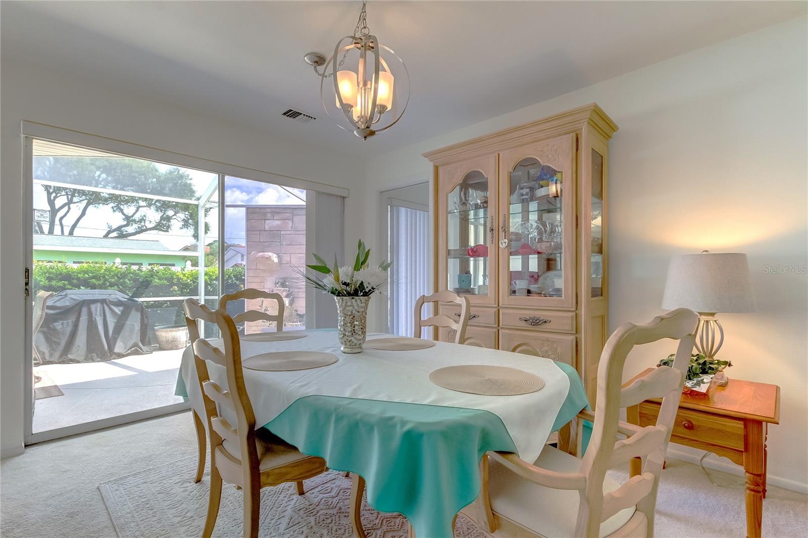 Formal Dining room with sliders to screened patio