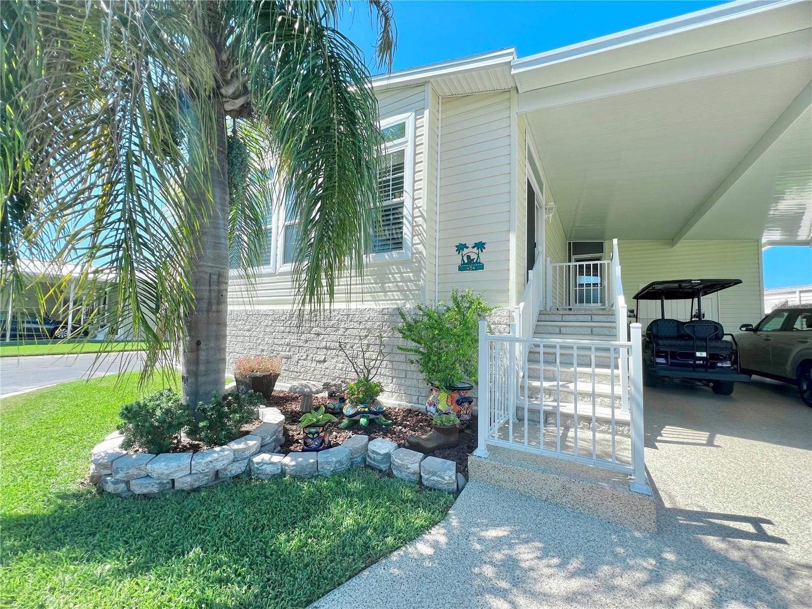 front of home with steps to sliders