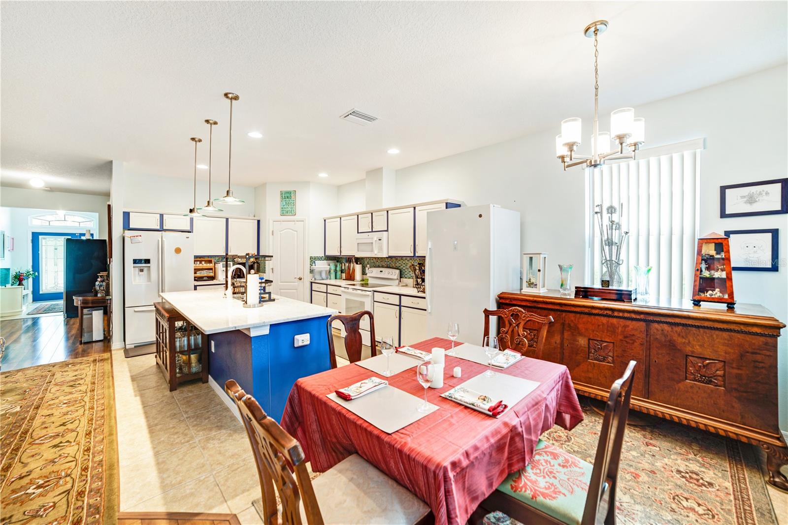 KITCHEN HAS ABUNDENT CABINETS AS WELL AS A CORNER PANTRY