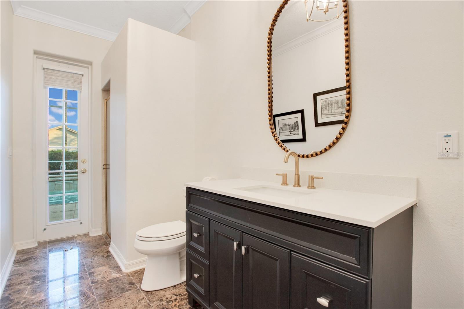 Downstairs guest bathroom/ pool bathroom