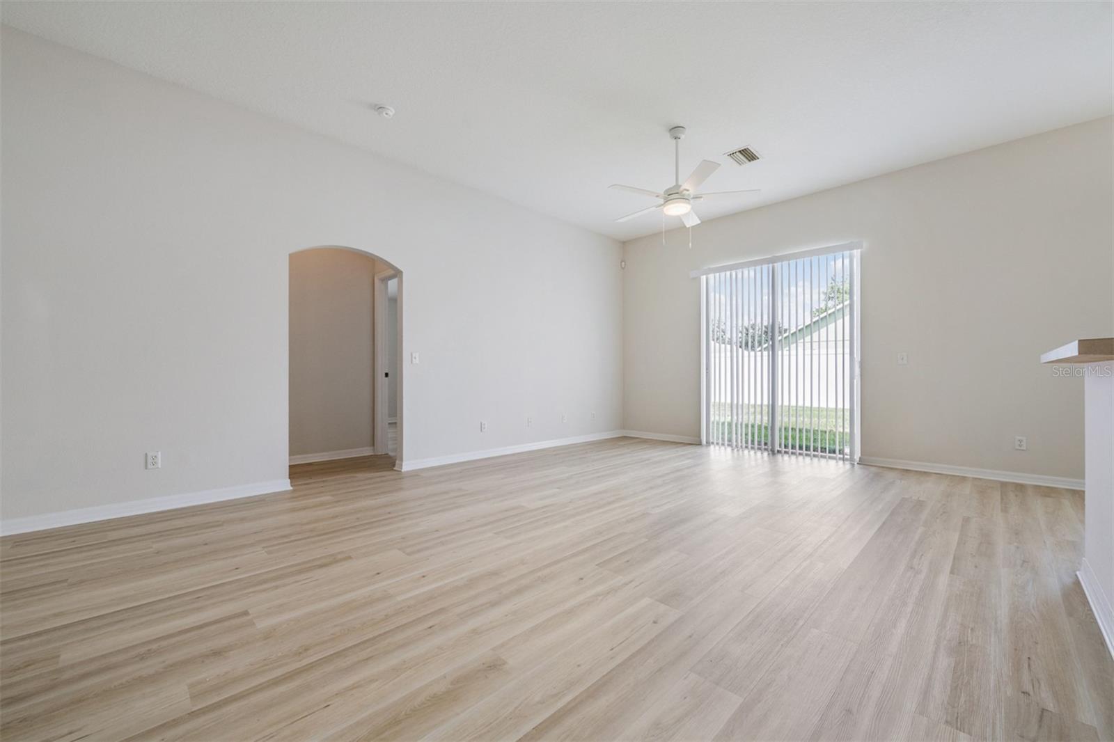 Huge Great Room with high ceilings, New LVP Flooring and Paint.