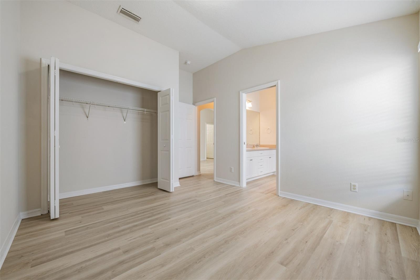 Guest Bedroom- New LVP Flooring, New Fixtures, New Paint and Hardware.