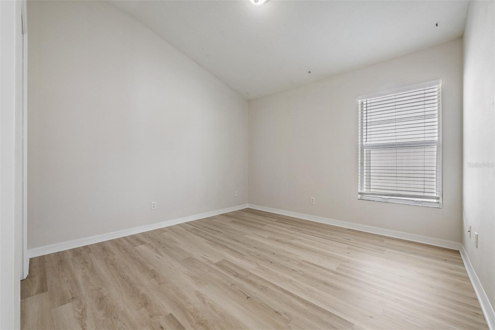 Guest Bedroom, New LVP flooring, high ceilings, new paint.