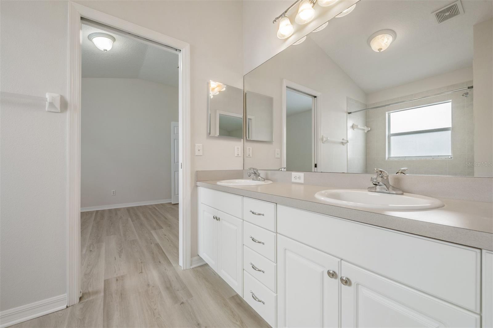 Jack and Jill Bathroom, Double Vanities, New LVP Flooring, New Fixtures and hardware.