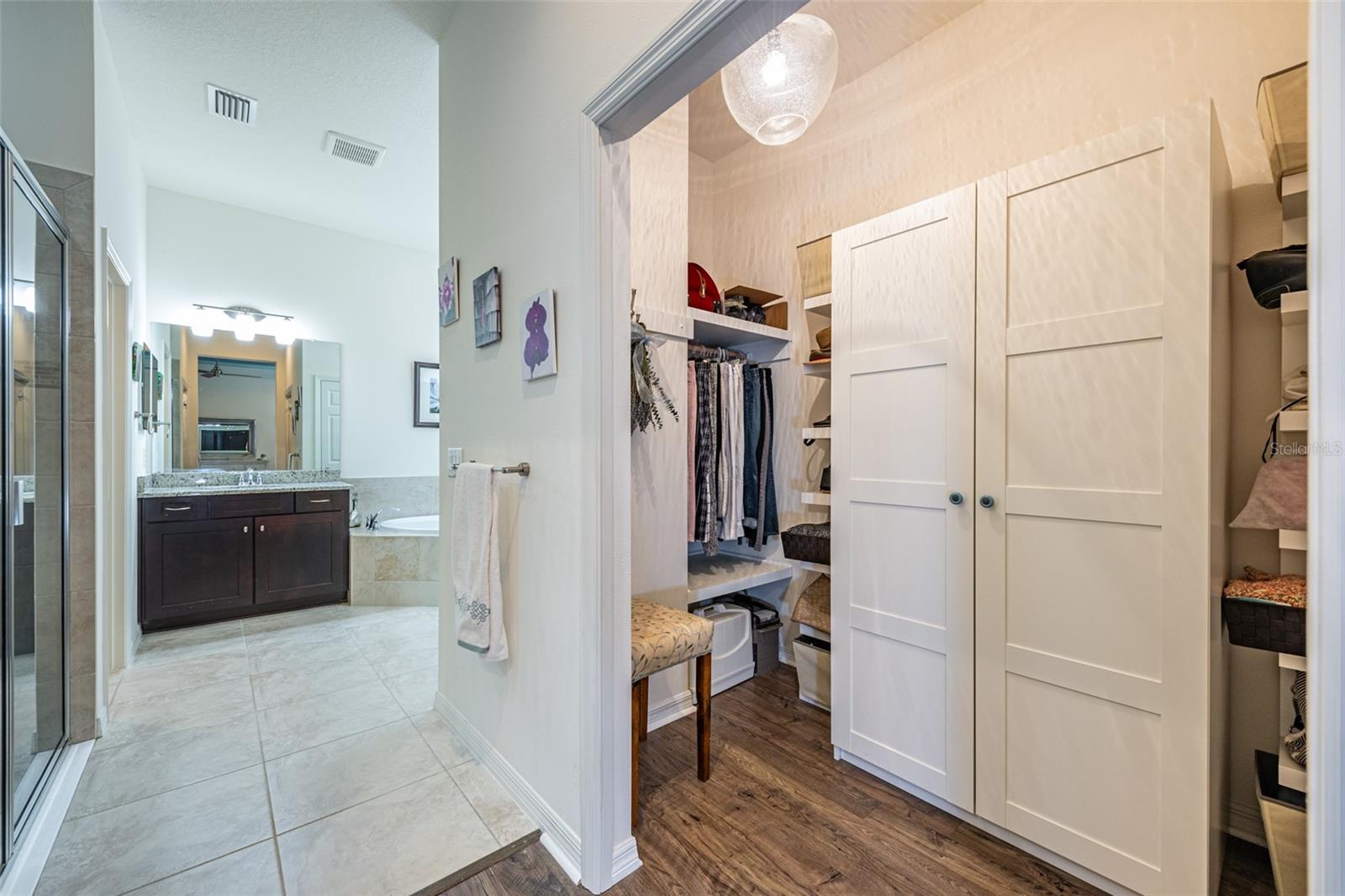 This walk-in closet storage will keep you organized.