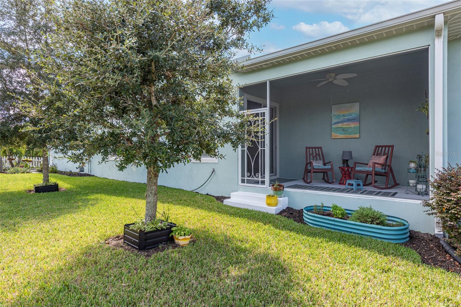 View of side porch from oversized side yard.