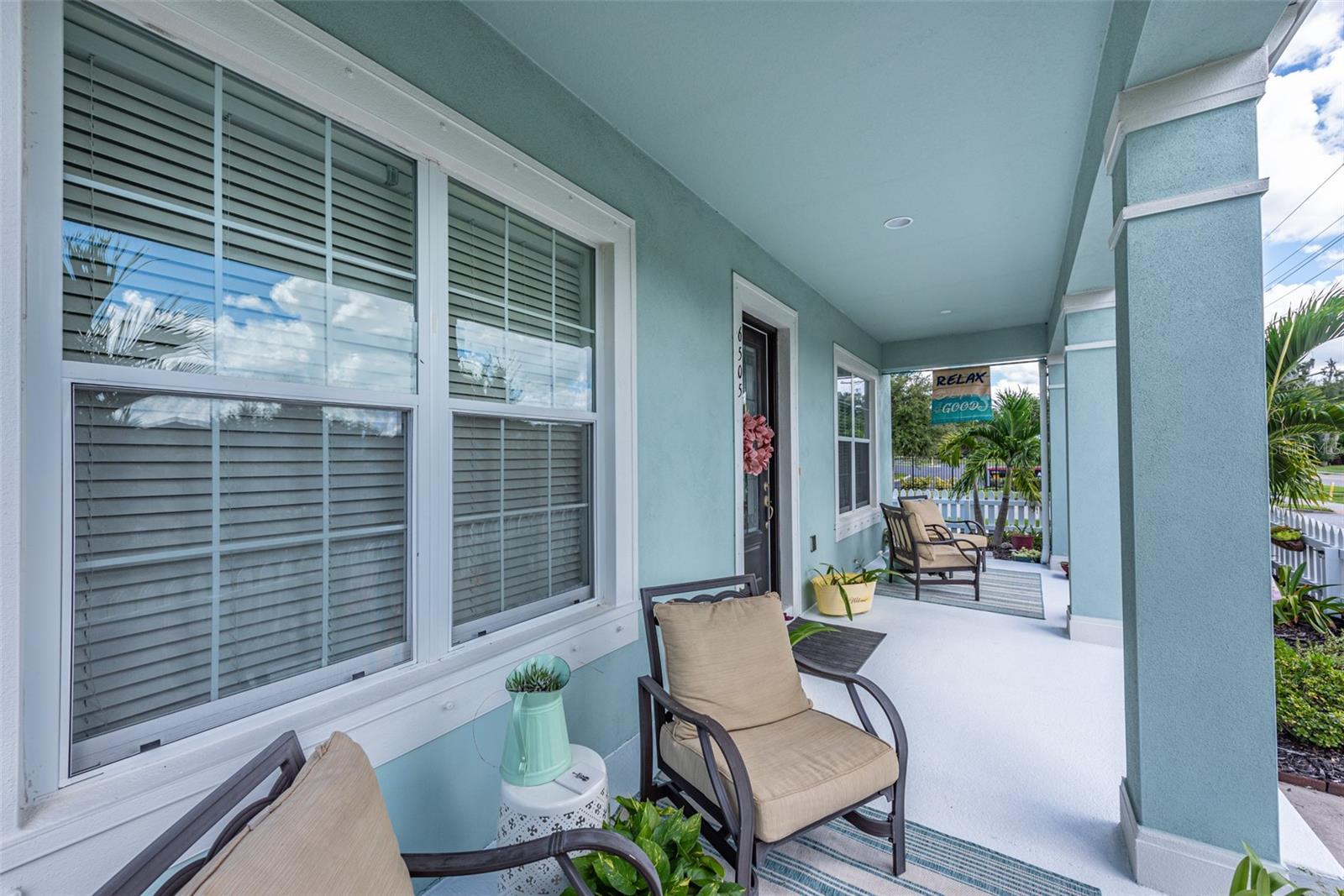 The front porch is the full width of this home.