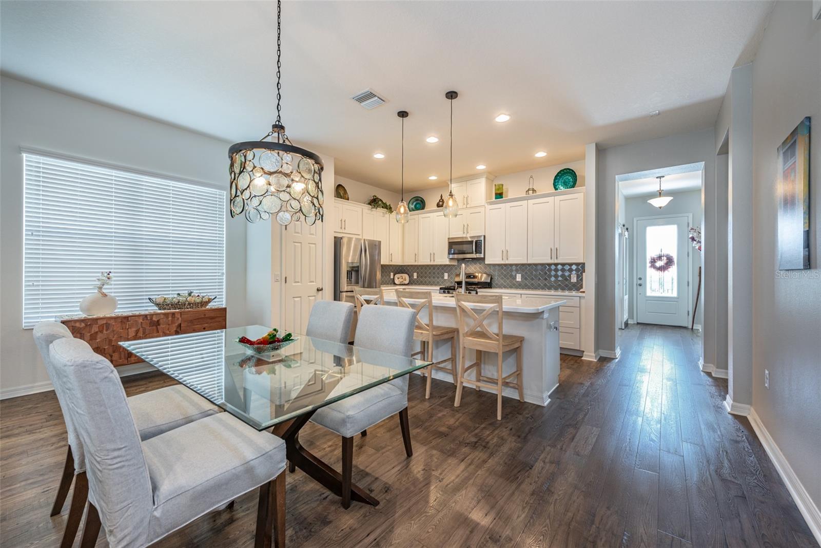 The Kitchen has Island seating and an area nearby for a large dining table.