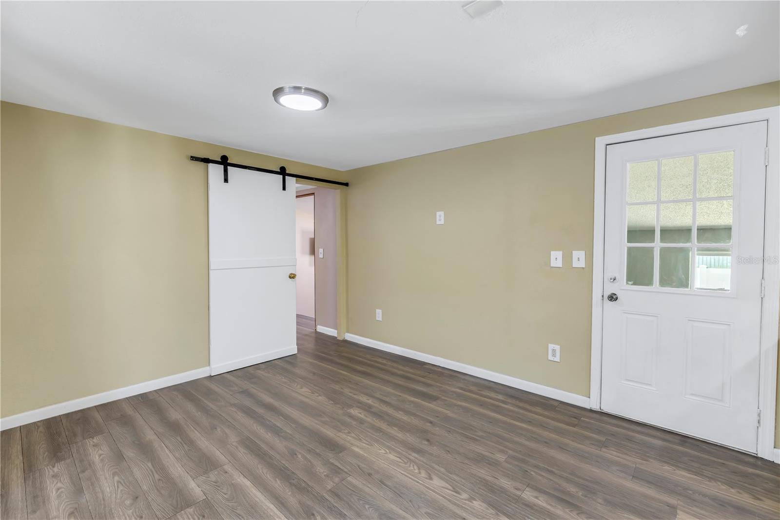 Barn door to primary bedroom