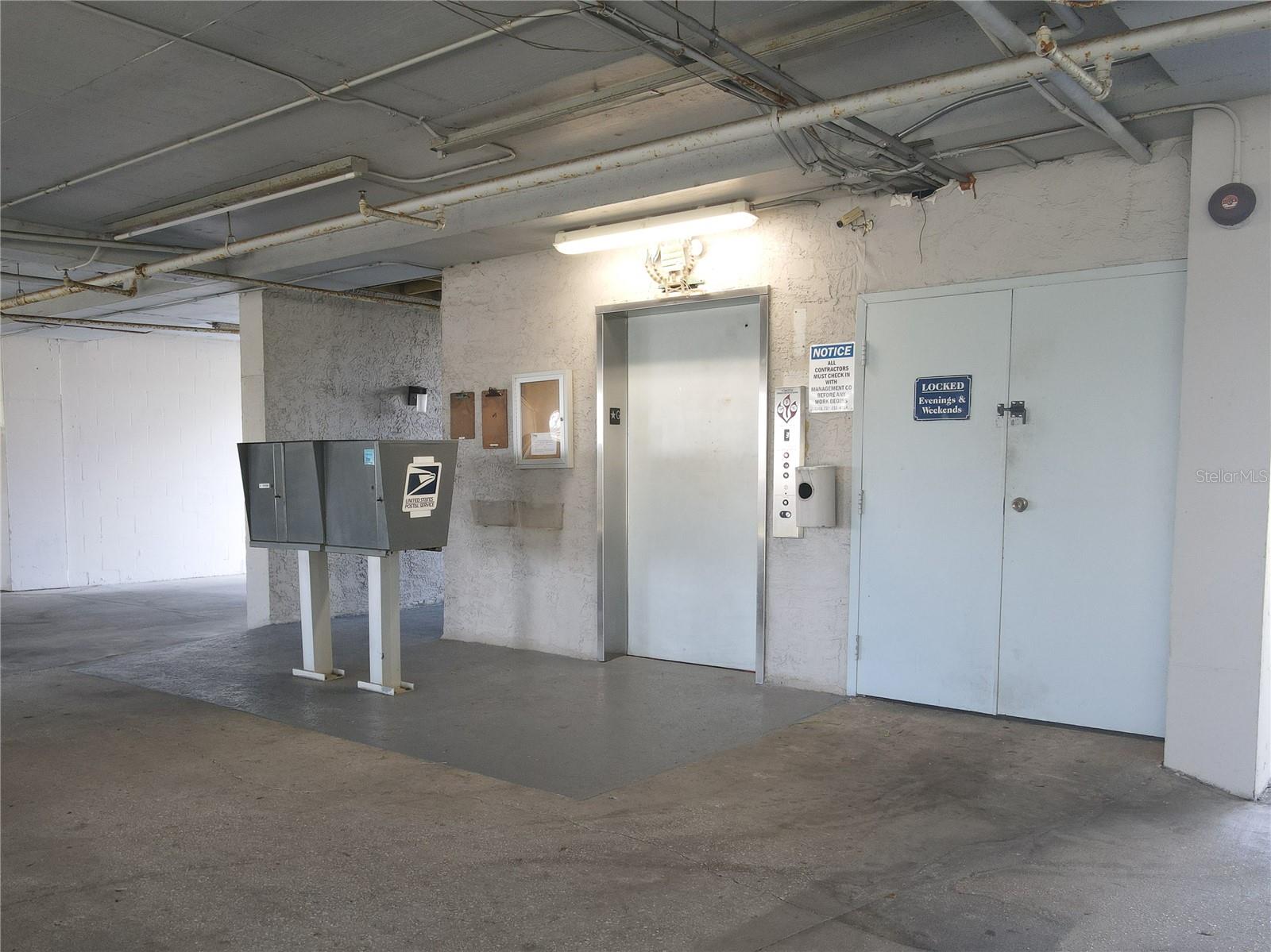 Elevator and mailboxes.