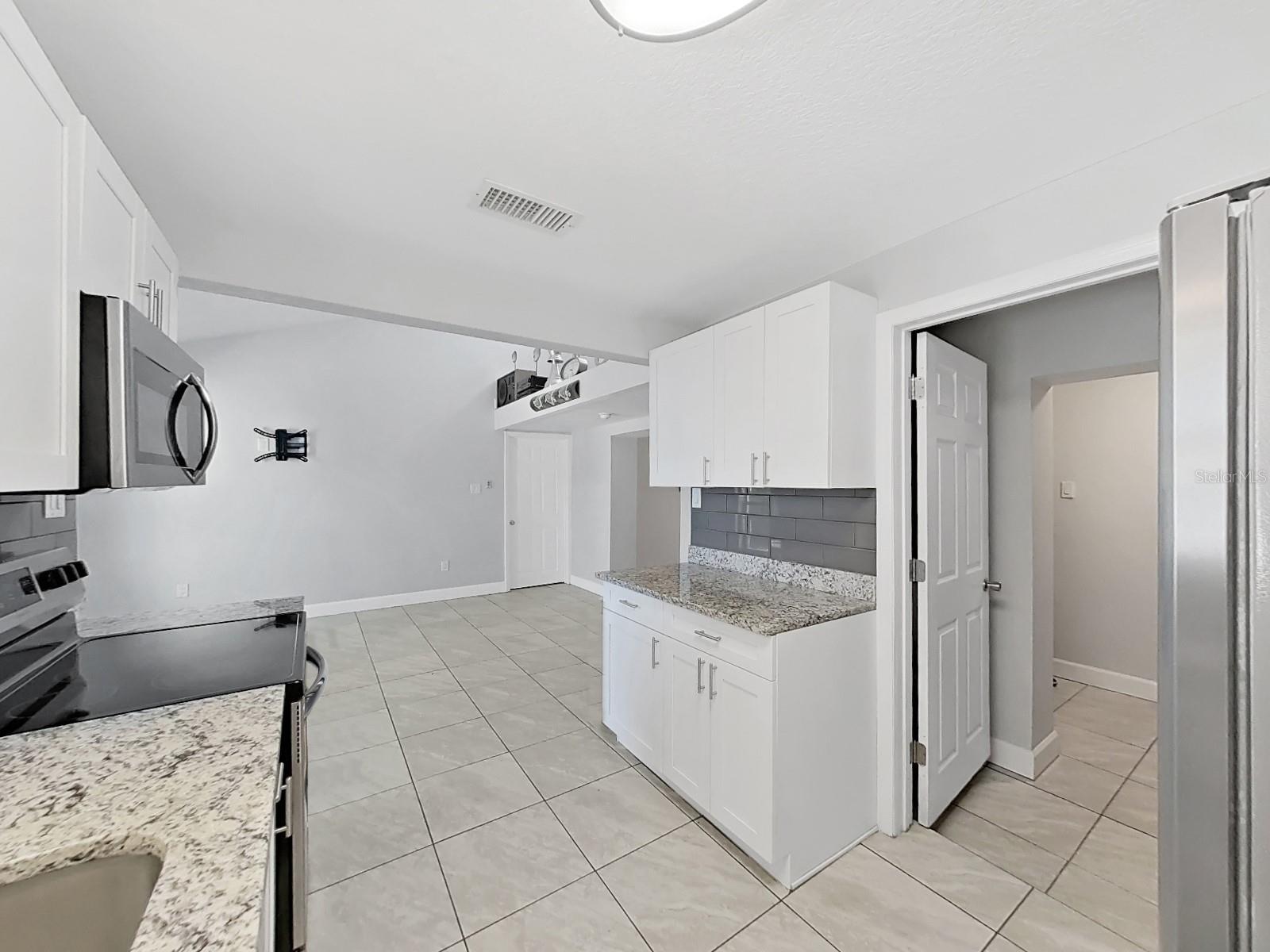 Kitchen with door to laundry room