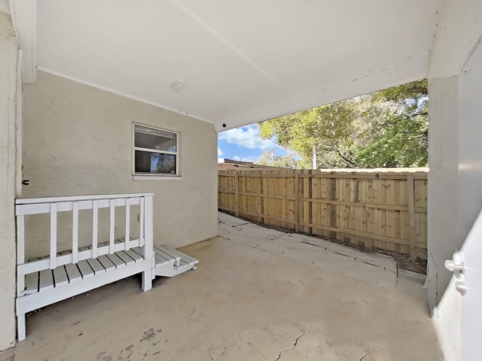 Covered patio, rear entrance to home