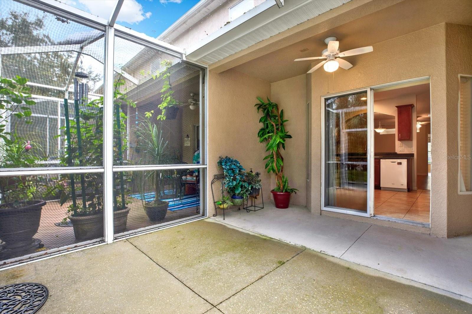 Enjoy the spacious lanai that overlooks the peaceful woods. This inviting outdoor area is perfect for relaxing or entertaining, with plenty of room for seating. It's a great spot to sip your morning coffee or unwind in the evening while taking in the natural beauty around you.