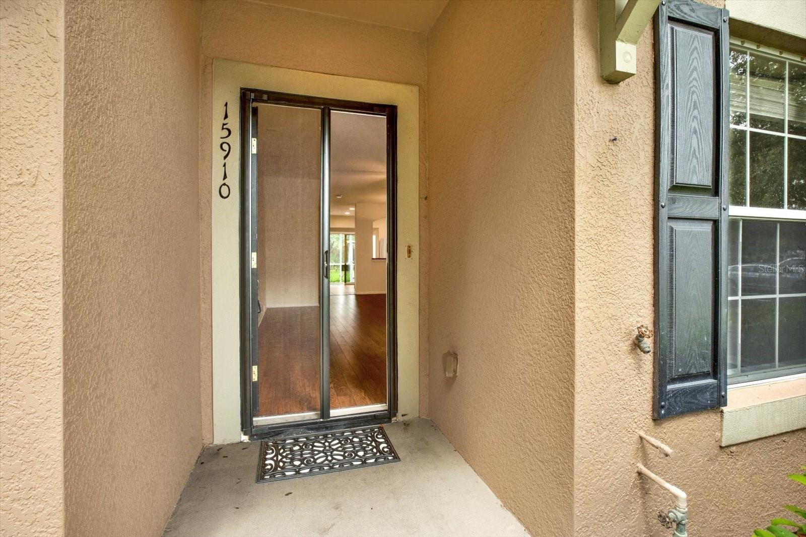 The front door is accented with a screen door to allow for those breathy evenings.