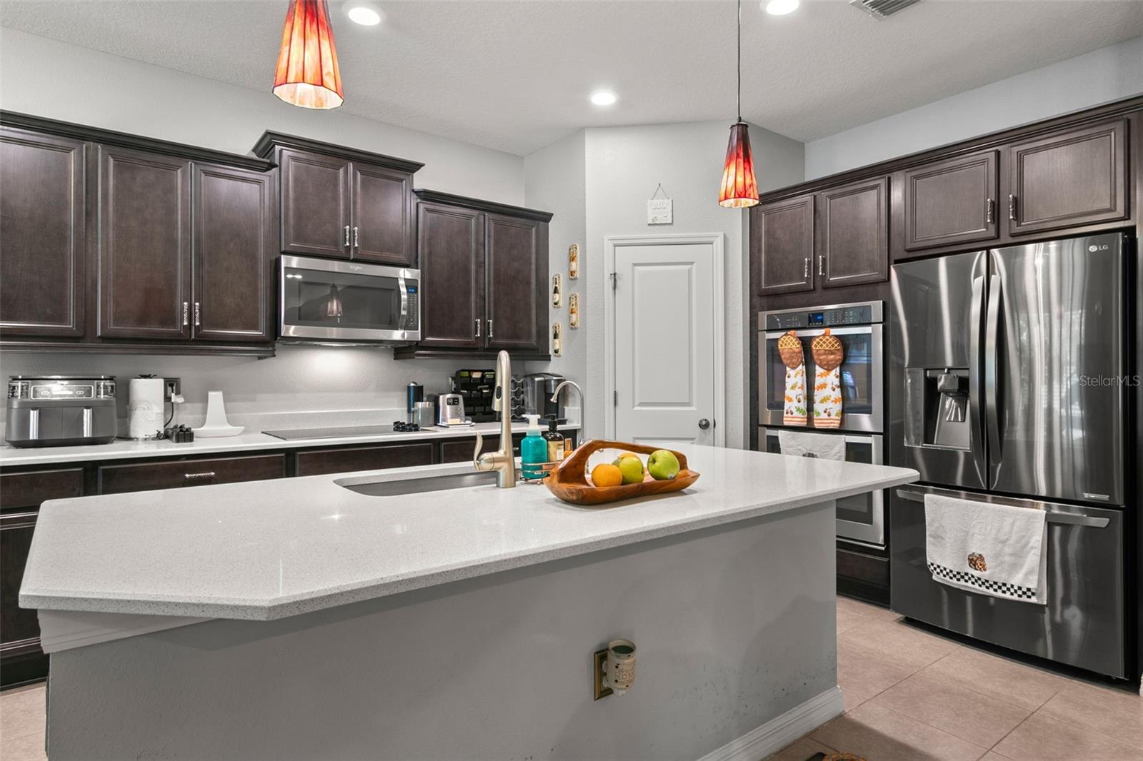 Gourmet Kitchen with Quartz Countertops and 42" Wood Cabinets