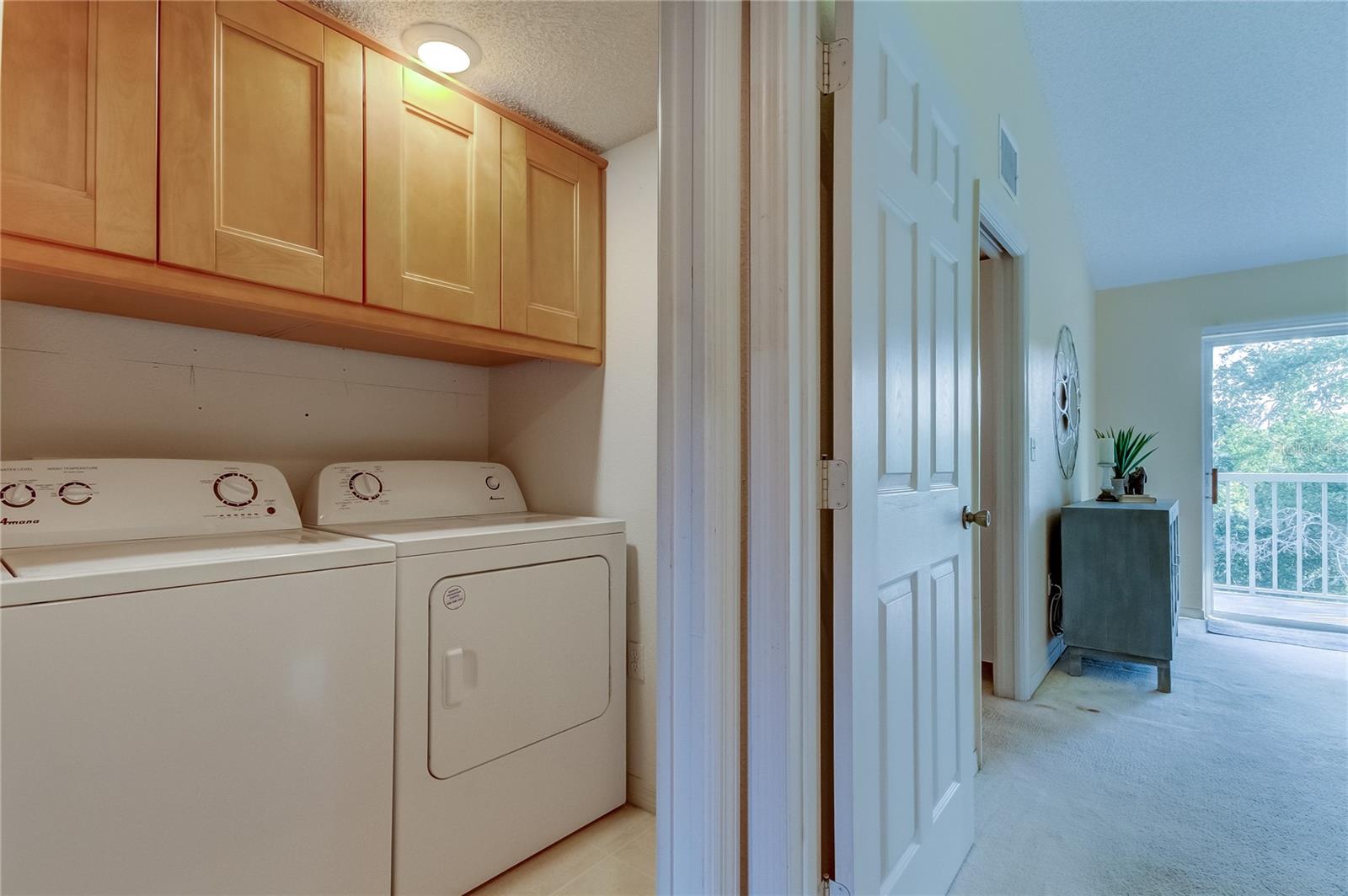 Laundry room area before entering primary bedroom.