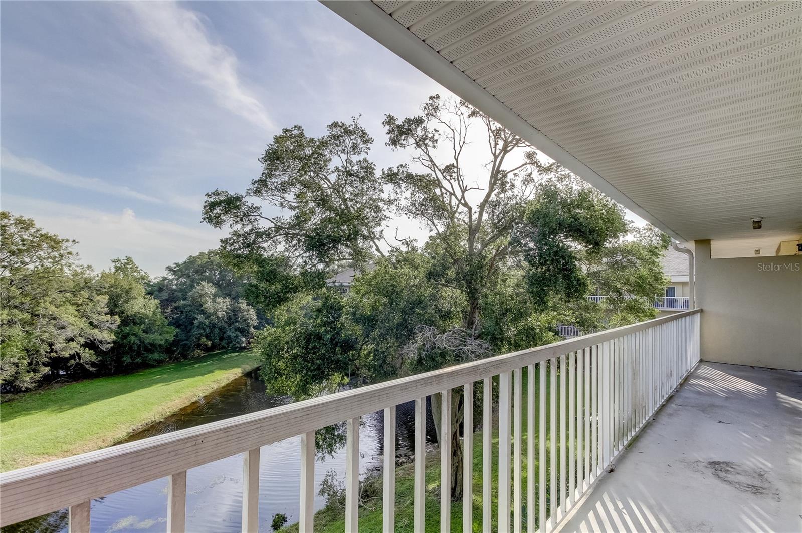 Balcony off family room overlooking pond.