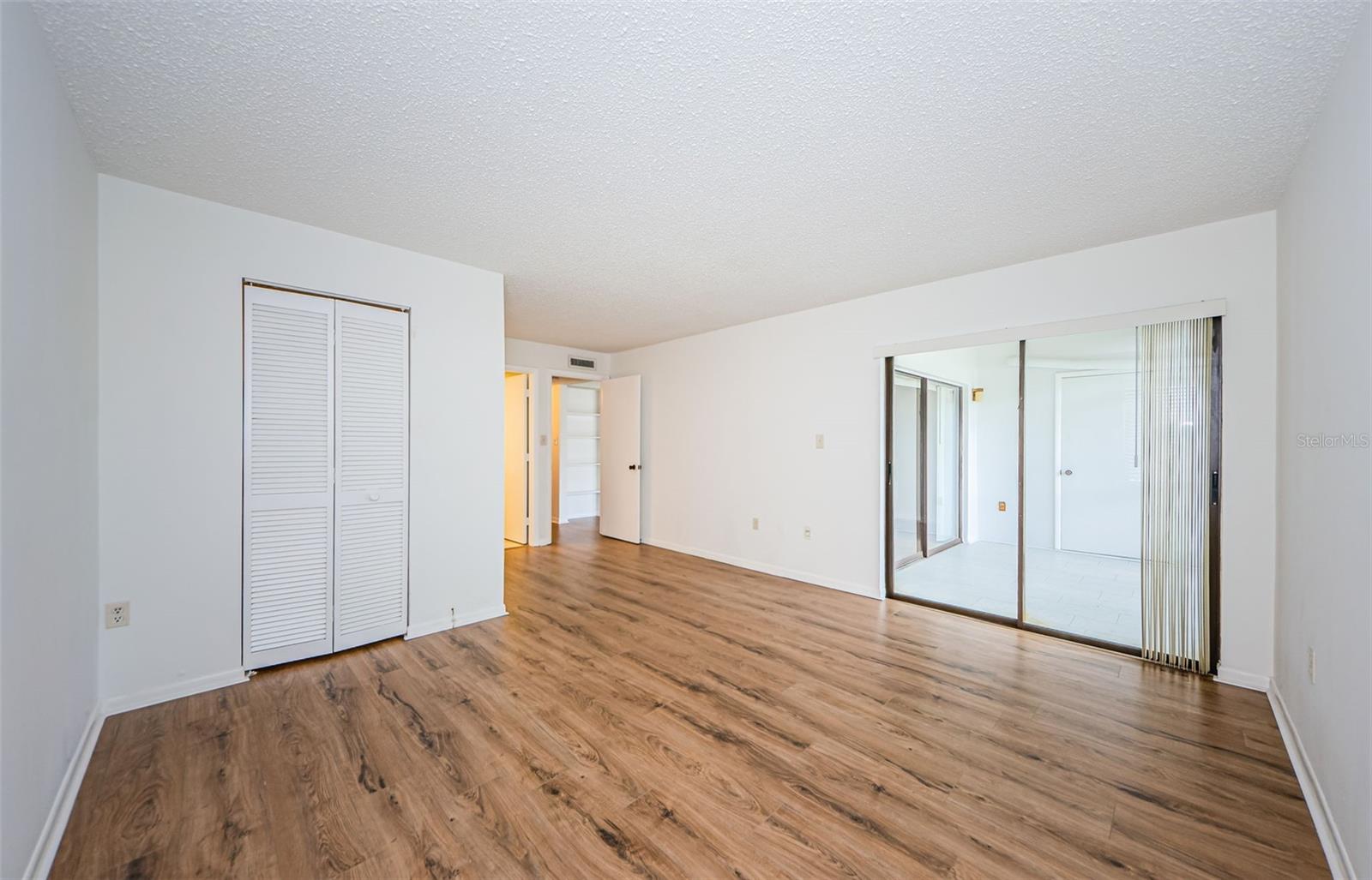 Nice size Master Bedroom with Sliding Doors to the Screened Lanai