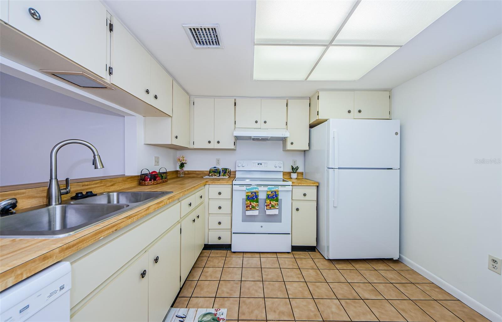 Kitchen with all new appliances, sink and garbage disposal. Lots of cabinets too.