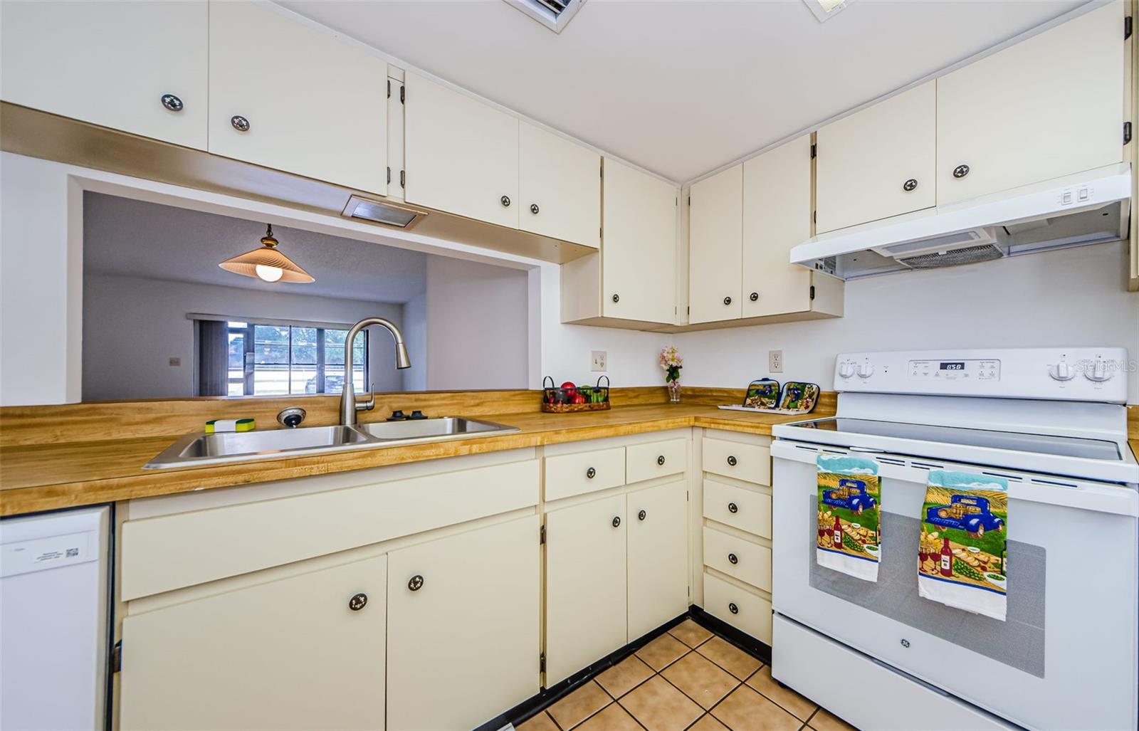 Kitchen opens to Living Room and Dining Room