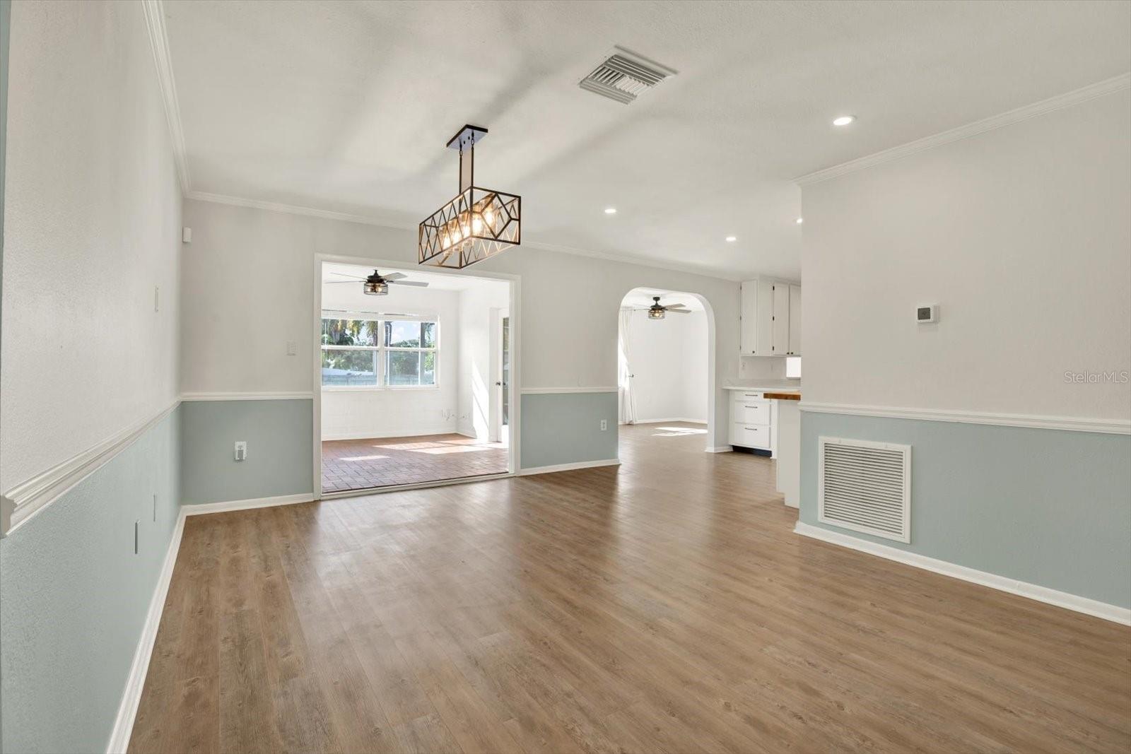 Dining space looking into flex space, living room, kitcehn area.