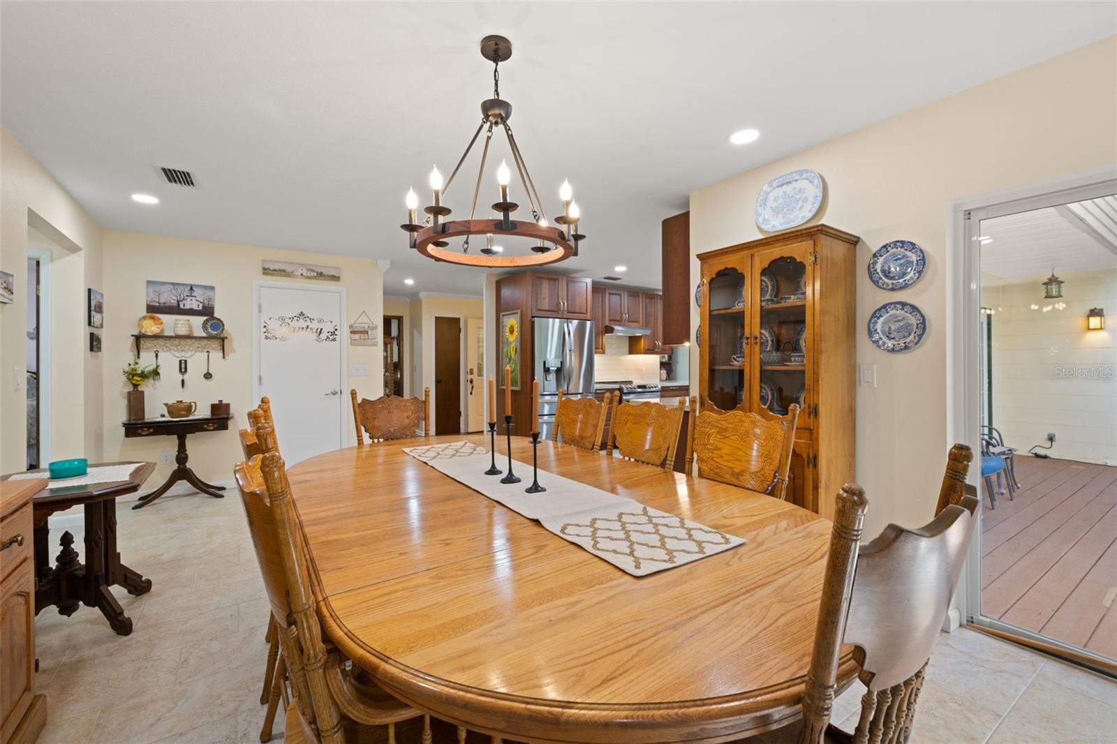 Dining Room with Updated Chandelier & Wood Burning Fireplace