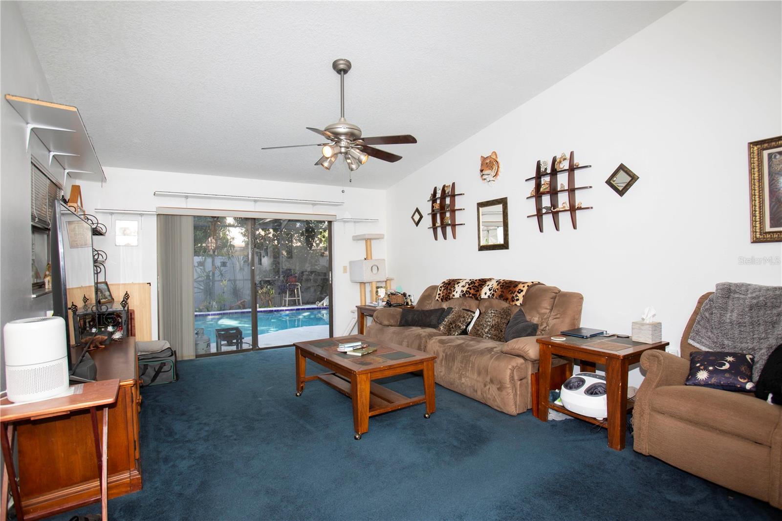 Large living room looking out at the pool