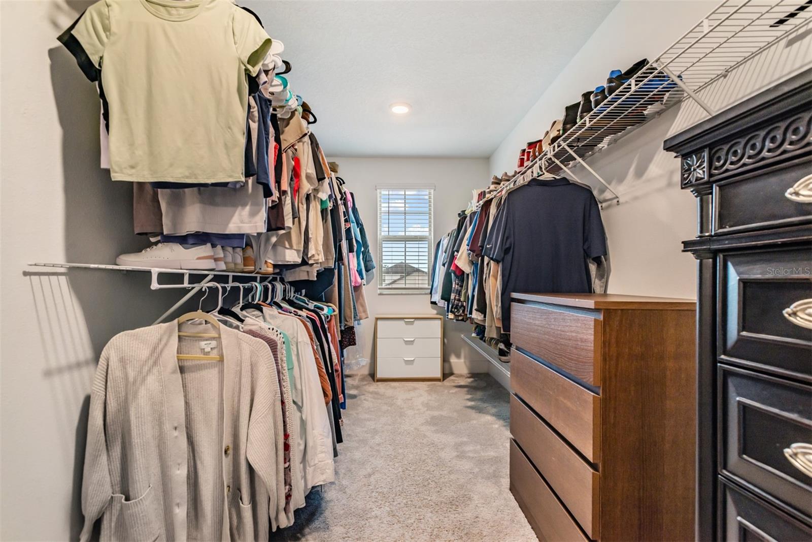 Extra large walk-in closet off of primary bathroom