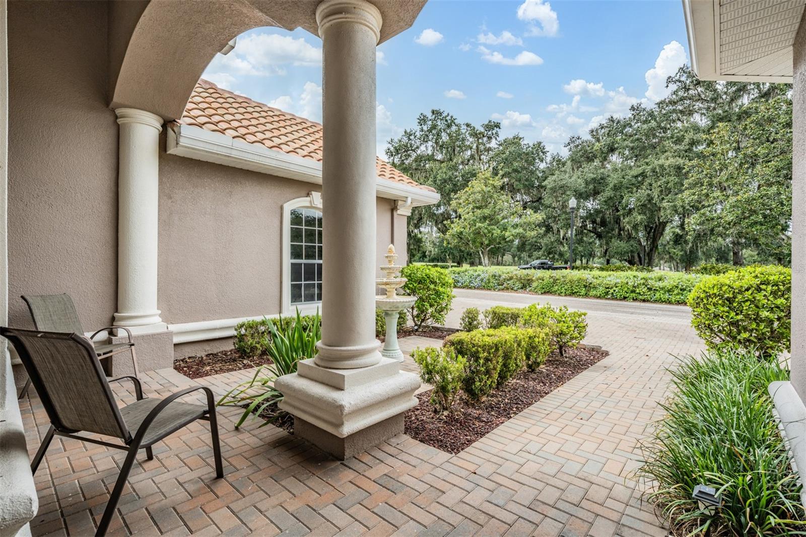 Paver walkway and arched front porch welcomes you!