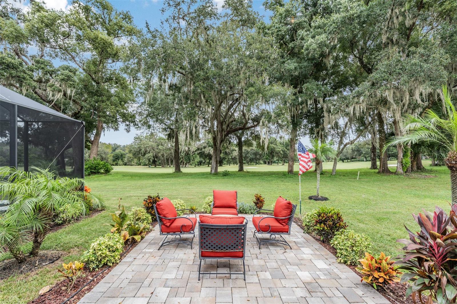 Relax on paver patio and watch golfers...